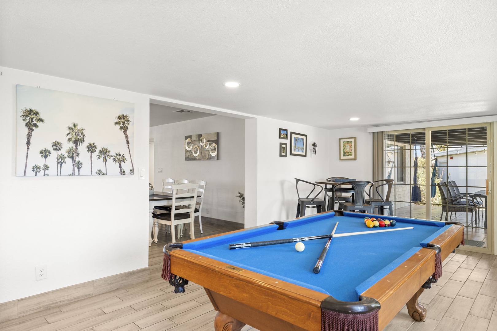 Game room with pool table and additional living area.