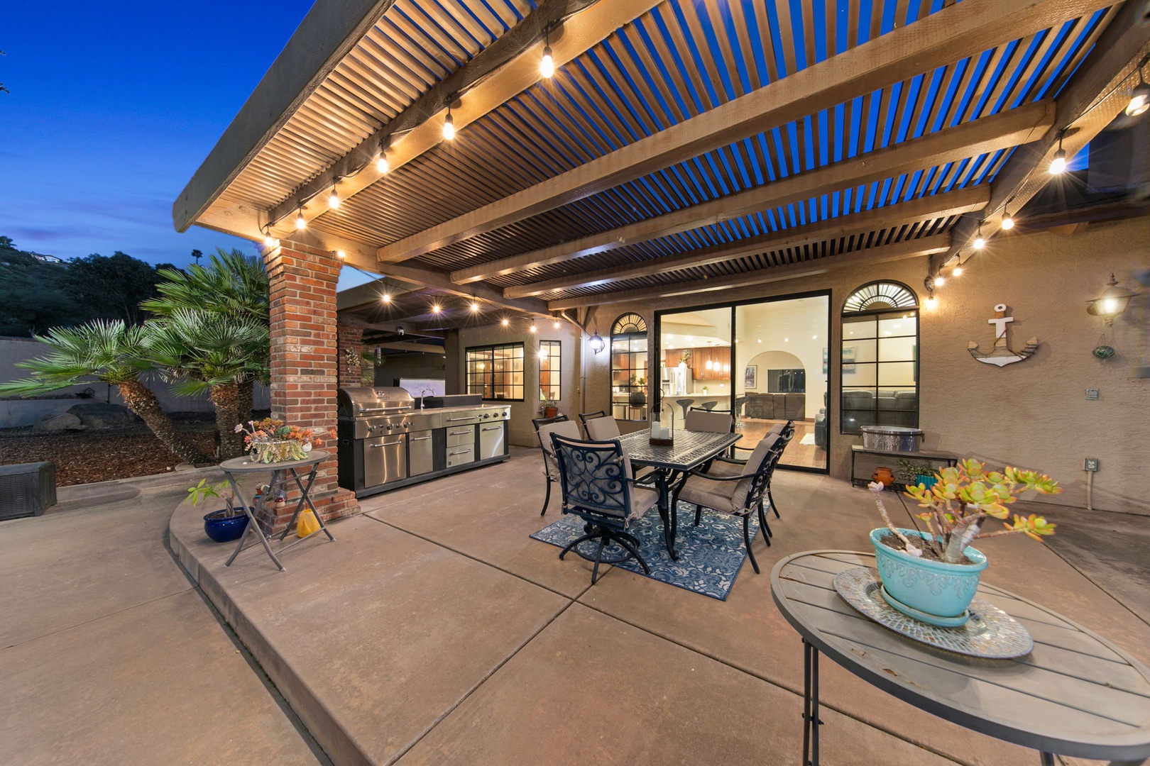 Unwind on your private patio with twinkling lights overhead while you grill dinner and dine al fresco under the stars.