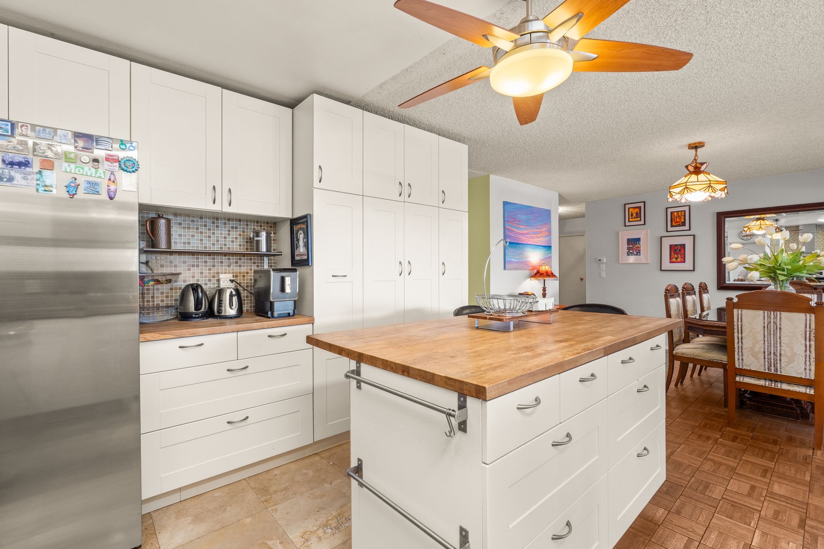 Cook memorable meals in this bright, fully-equipped kitchen with modern appliances and spacious island perfect for gathering.