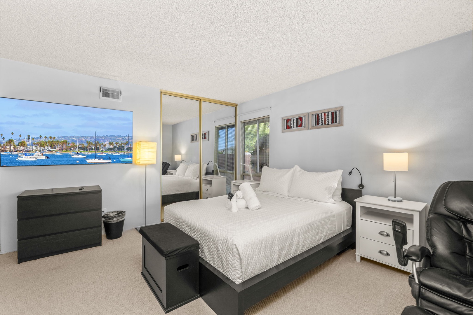 Unwind in your serene bedroom featuring crisp linens, mirrored closets, and thoughtful furnishings that create the perfect retreat for restful nights.