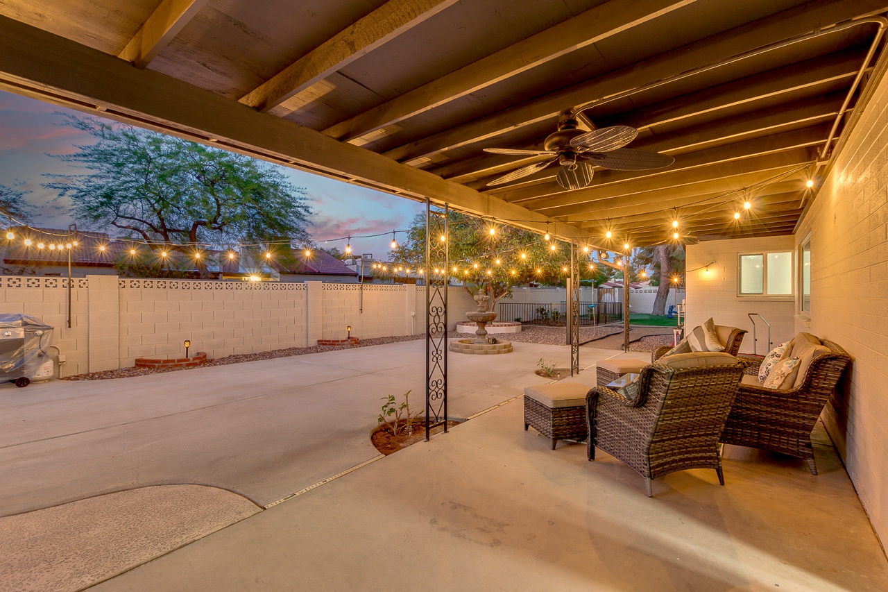 Covered patio lounge with table and chairs