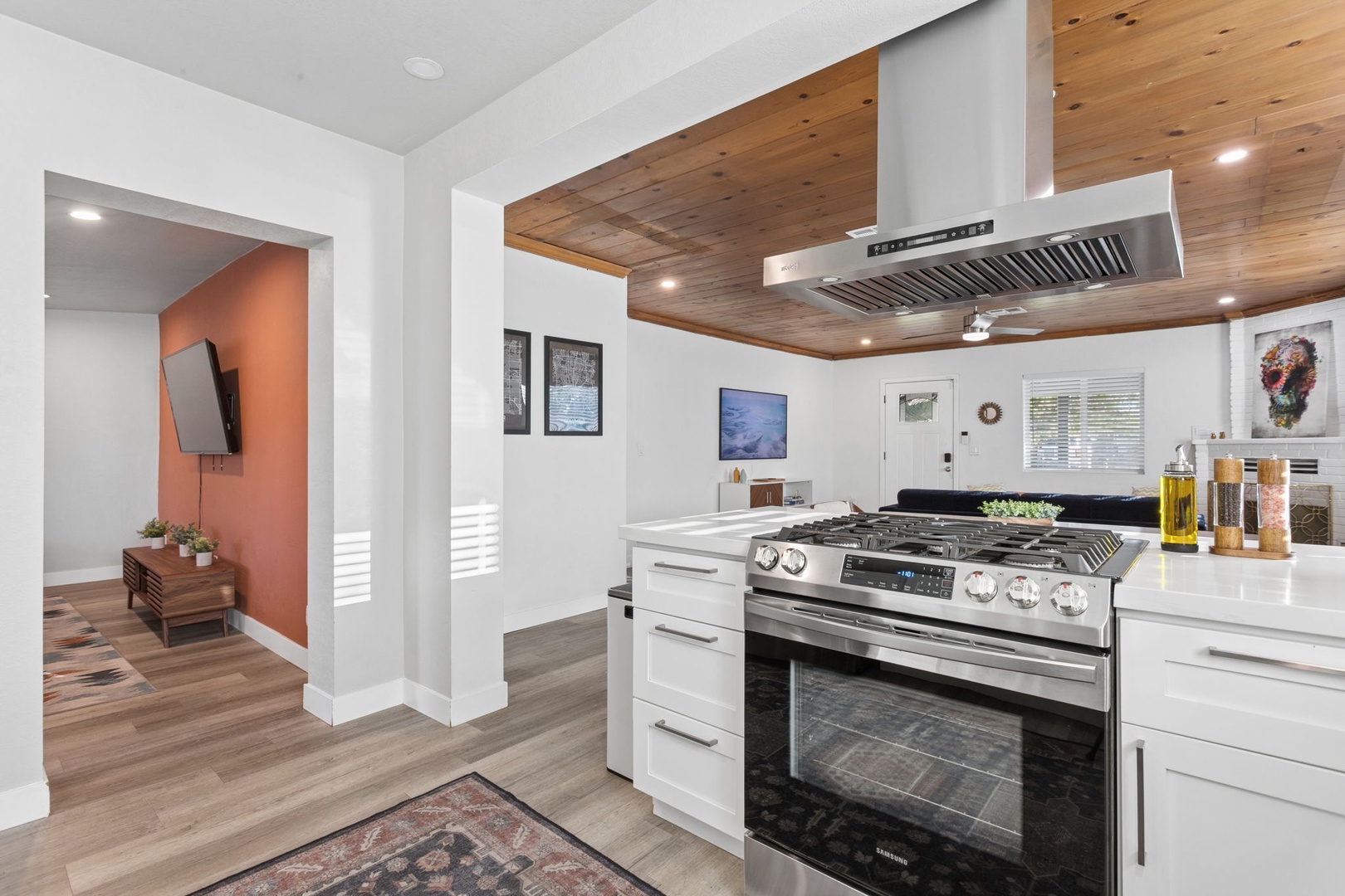 Your modern kitchen features a spacious island with professional-grade gas range, perfect for creating memorable meals together.