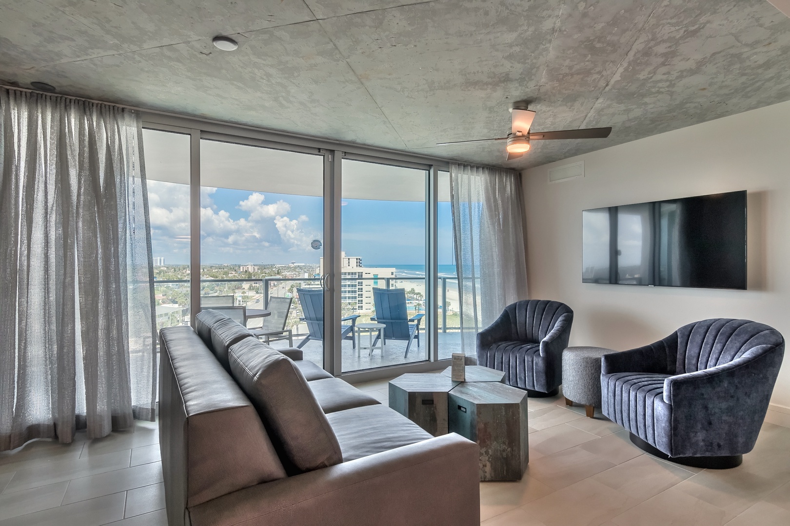 Embrace the Scenery: Stylish Living Room with Captivating Ocean and City Views
