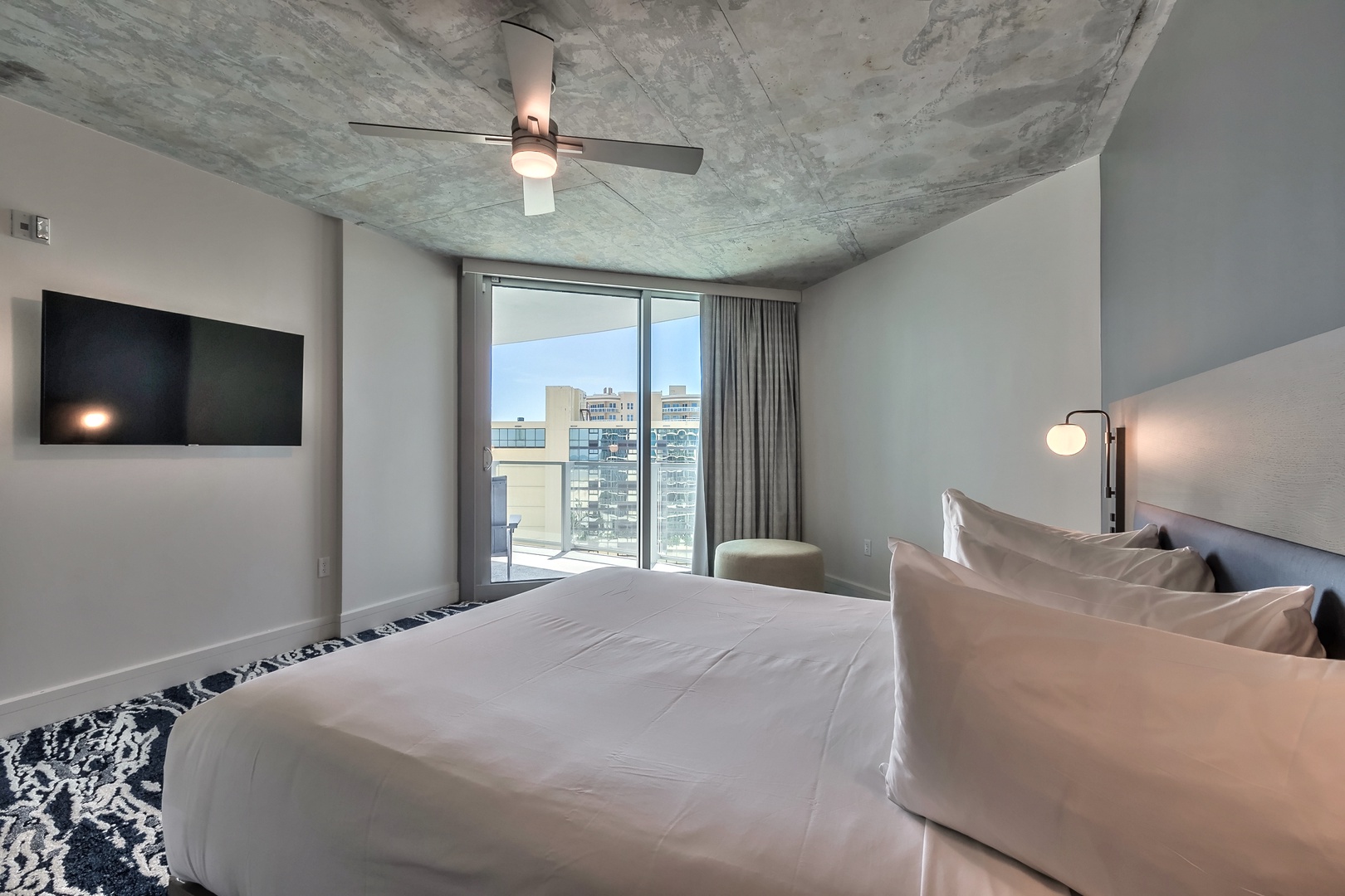 City Lights & Coastal Comfort: Relax in the King Bedroom with Panoramic Vistas