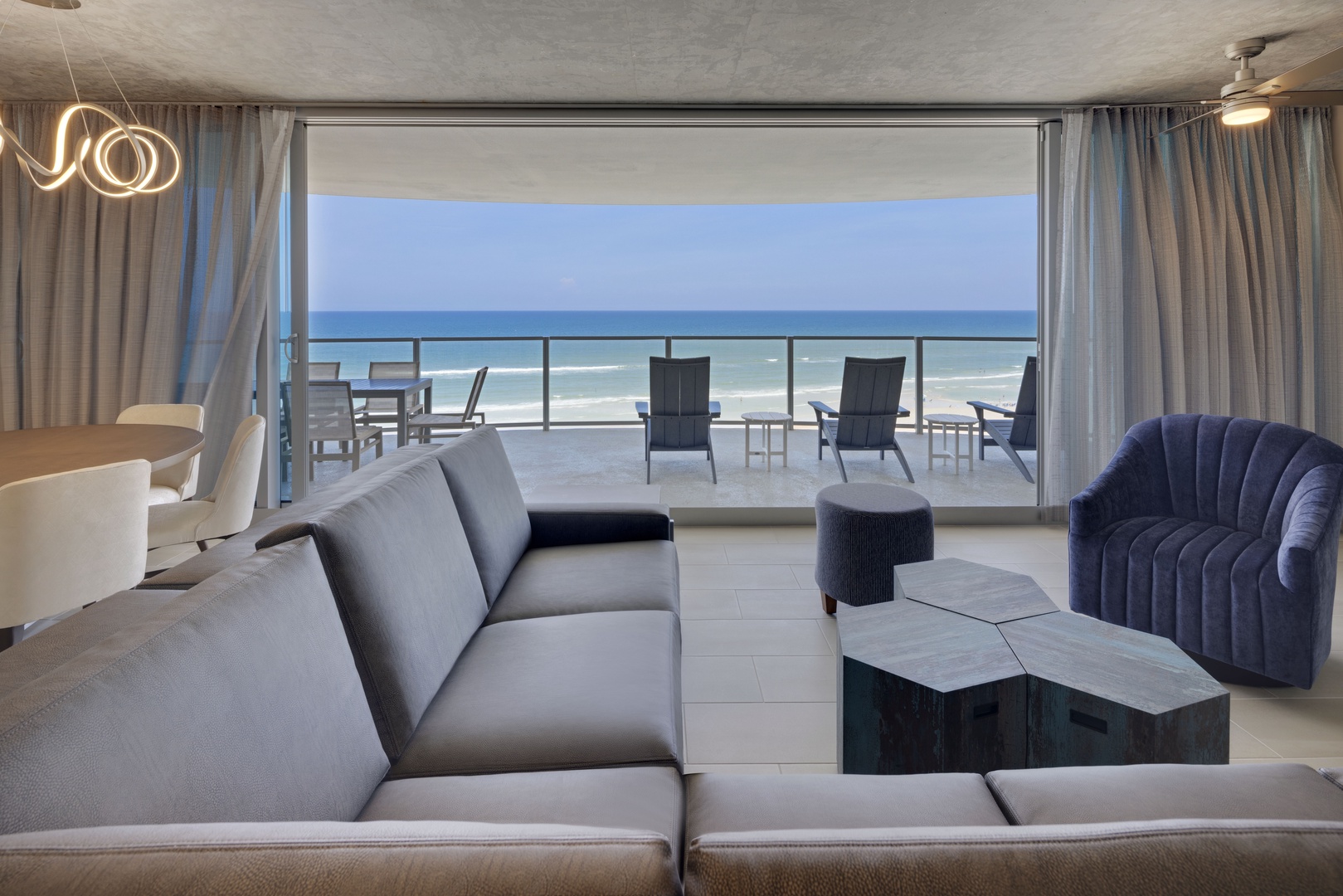 Seamless Indoor/Outdoor Living: The Spacious Living Room Opens to an Oceanfront Terrace