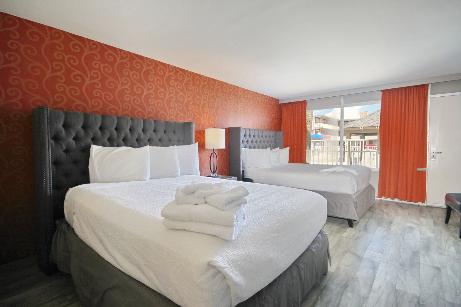 Bright and airy double queen bedroom