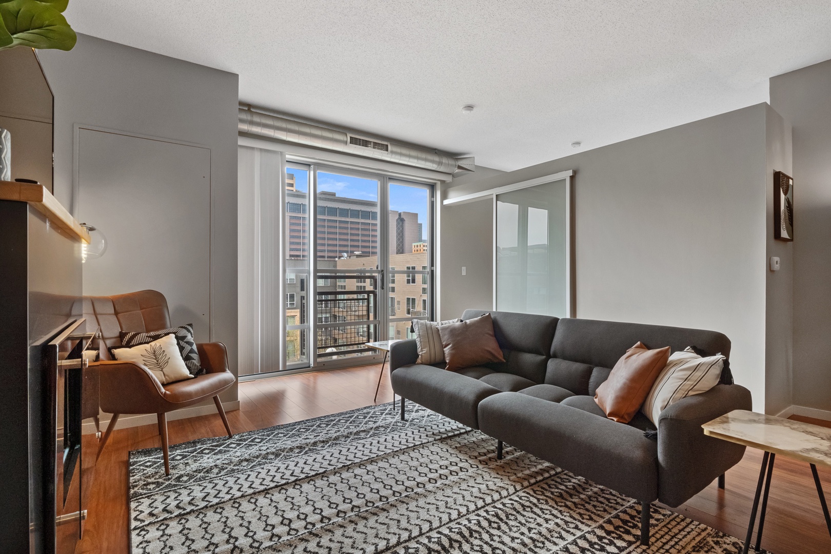 Your Urban Retreat: Bask in the Sunlight and Warmth of the City Club Living Room