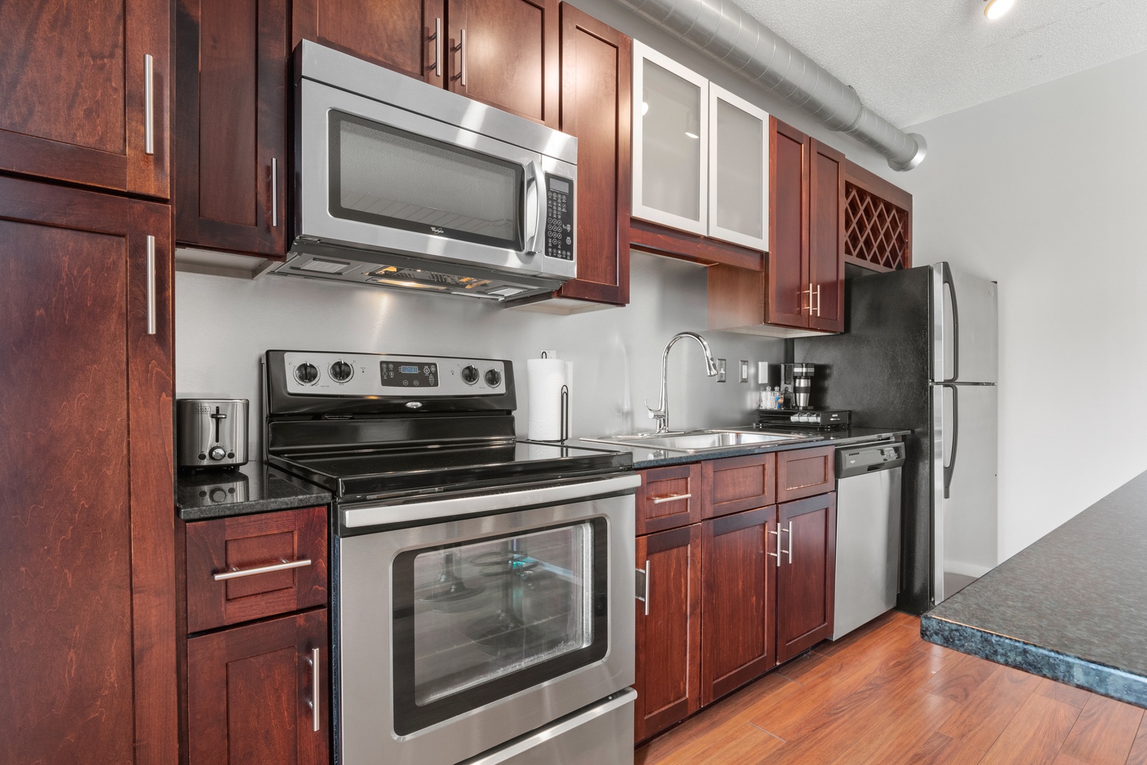 Cook, Unwind, Recharge: Everything You Need in The City Club's Kitchen and Living Area