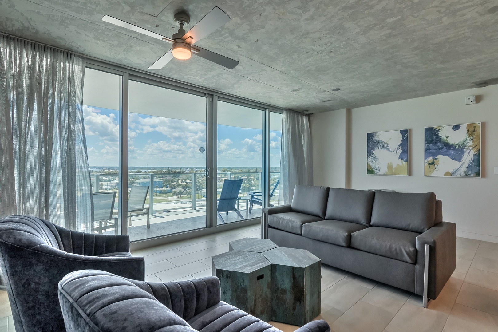 Urban Oasis: Modern Living Room Retreat with Both Urban and Ocean Panoramas