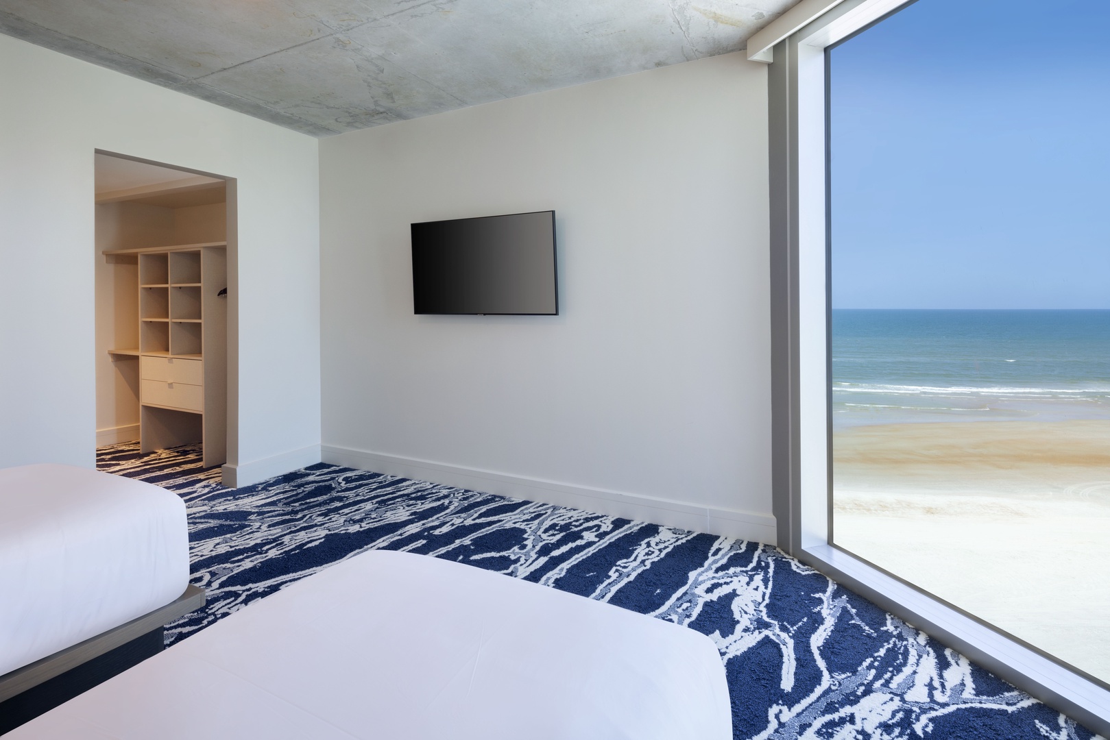 Seaside Escape: Twin Bedroom with Ocean-Inspired Decor and Plush Comfort