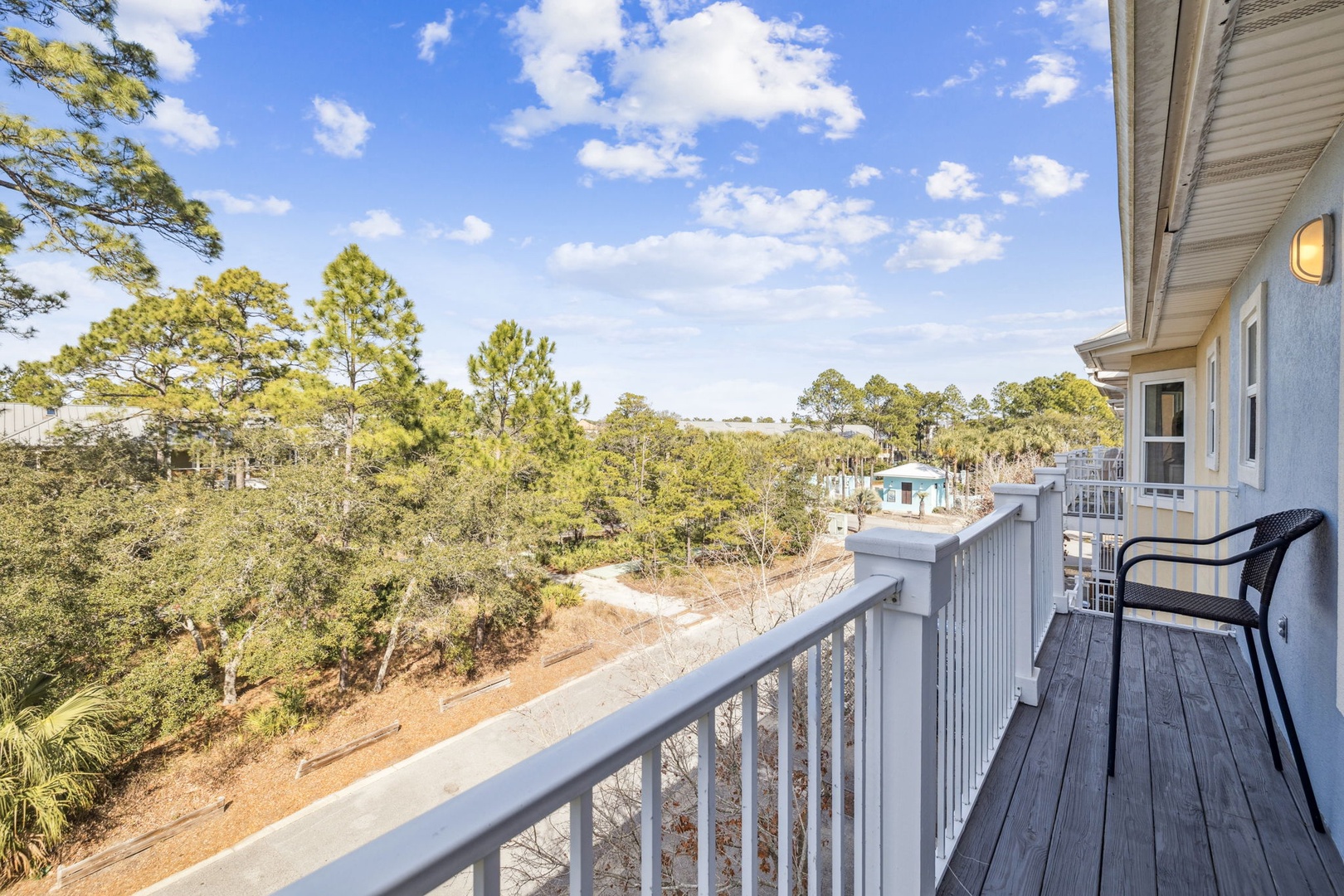 Sip your morning coffee on this peaceful balcony while soaking in tree-lined views that stretch toward the horizon.