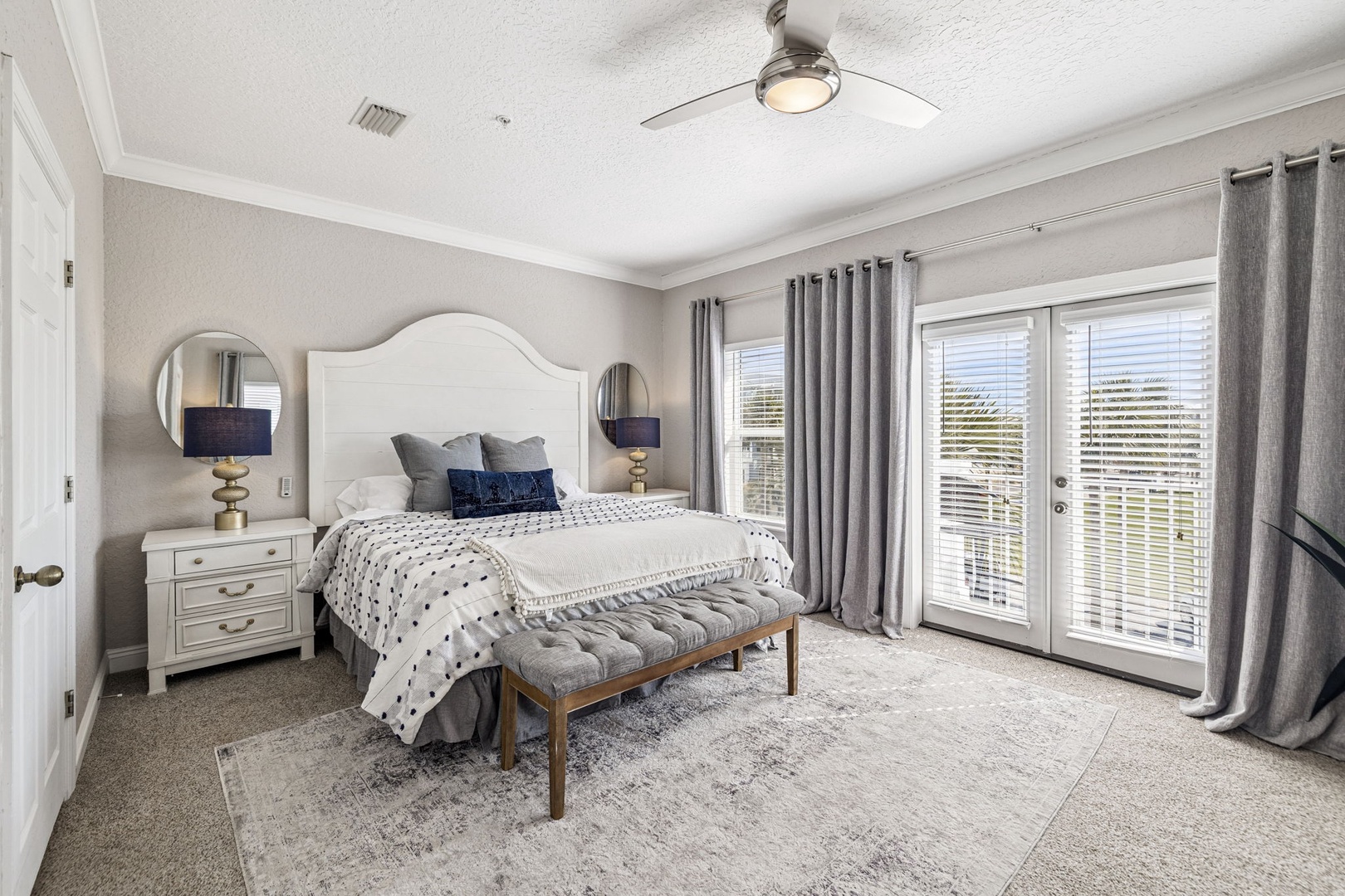 Sink into plush bedding and wake up refreshed in your spacious bedroom with private balcony access and elegant furnishings.