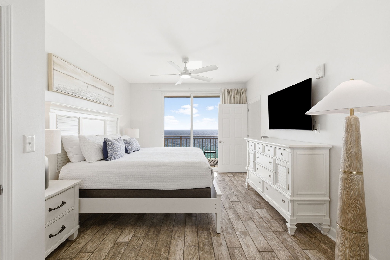 Wake up in your serene bedroom with crisp white linens and mountain views from your private balcony.