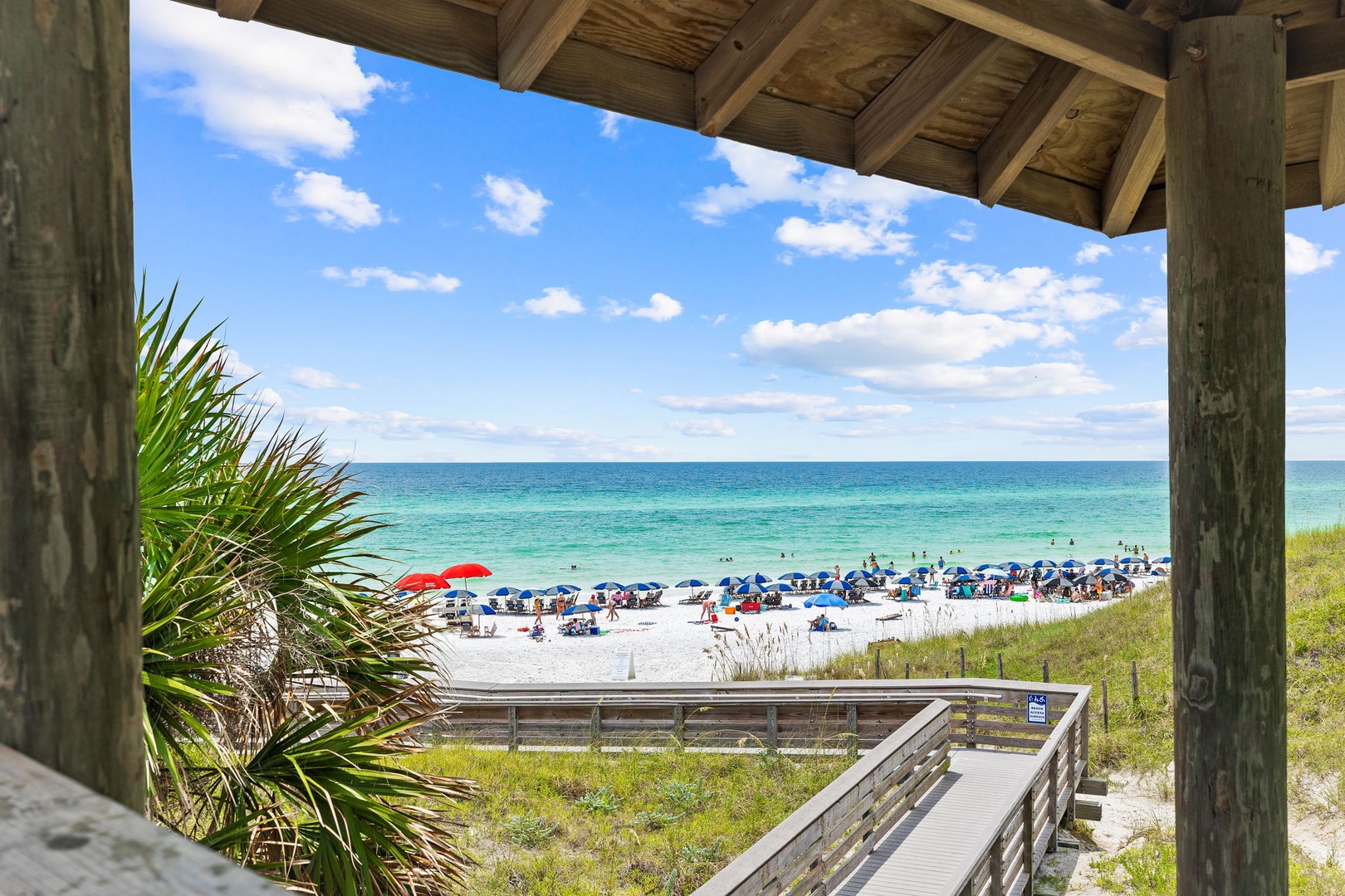 Stunning beachfront pavilion offering panoramic ocean views and direct beach access with pristine white sand.