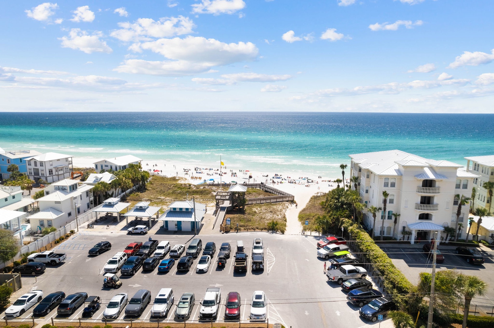 Stunning beachfront destination with convenient parking and direct access to pristine white sand beaches and turquoise waters.