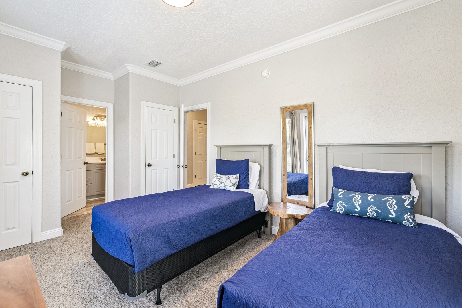 Rest peacefully in your twin bedroom with comfortable beds and coastal-themed linens, featuring nautical touches that bring seaside charm to your stay.