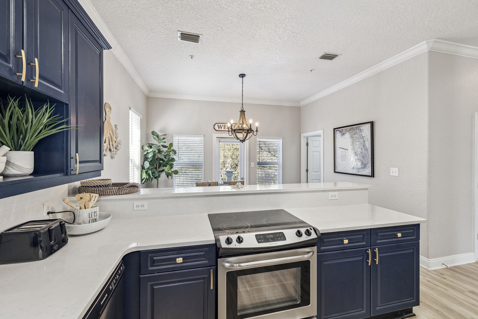 Your stylish kitchen features navy cabinets, gleaming countertops, and modern appliances where you'll love preparing meals.