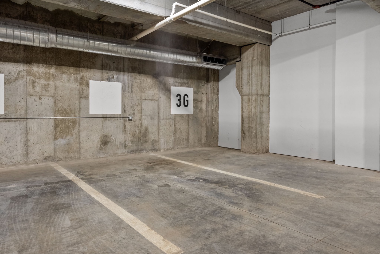 Covered parking spot with easy access and clear signage marking space 3G in the building's garage.
