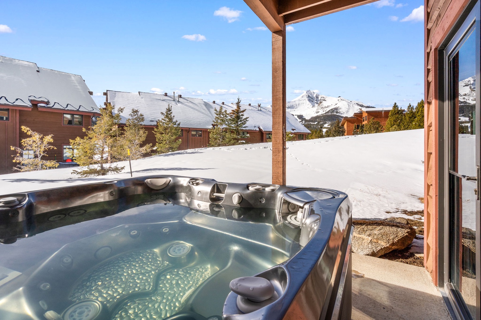Soak in your private hot tub while gazing at snow-capped peaks and pristine mountain views.