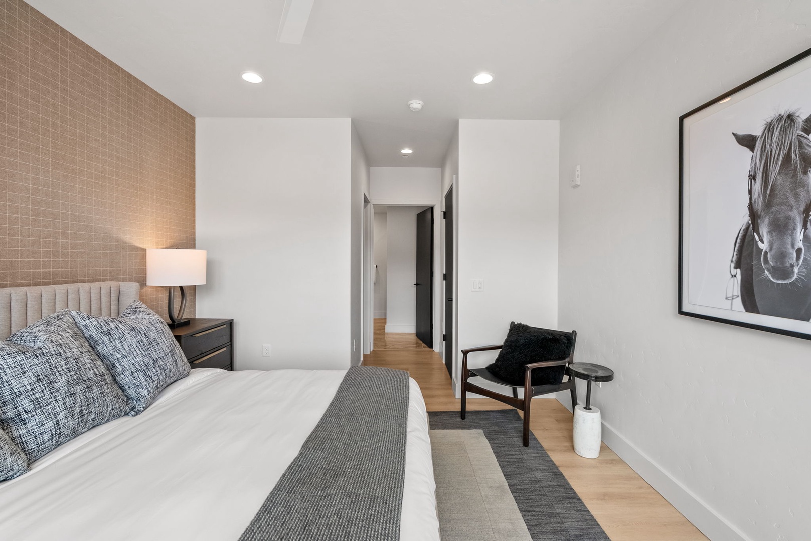 Slip into crisp linens and let the soft glow of your bedside lamp ease you into relaxation. Warm textures and modern touches create your personal sanctuary.