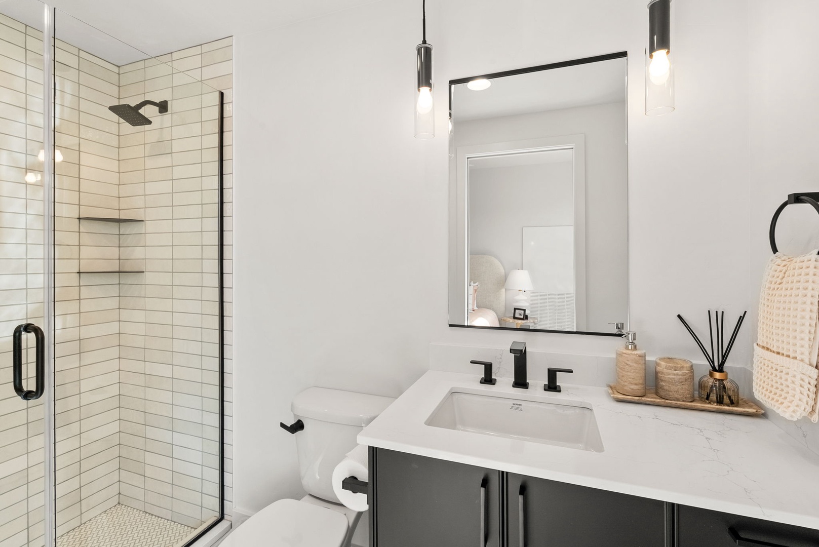 Your stylish bathroom features modern fixtures and a refreshing rain shower. Soft lighting and natural textures create a spa-like retreat after a day of exploring.