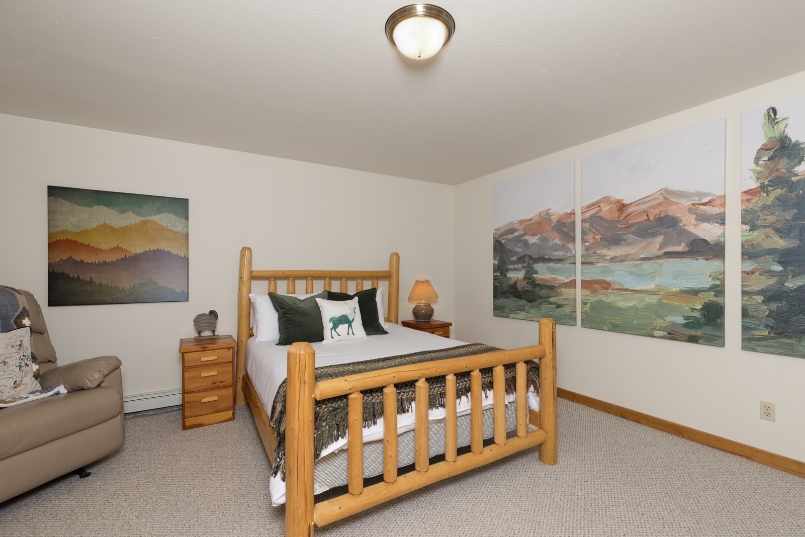 Drift into restful sleep surrounded by mountain artwork and nature-inspired decor in your cozy bedroom retreat.