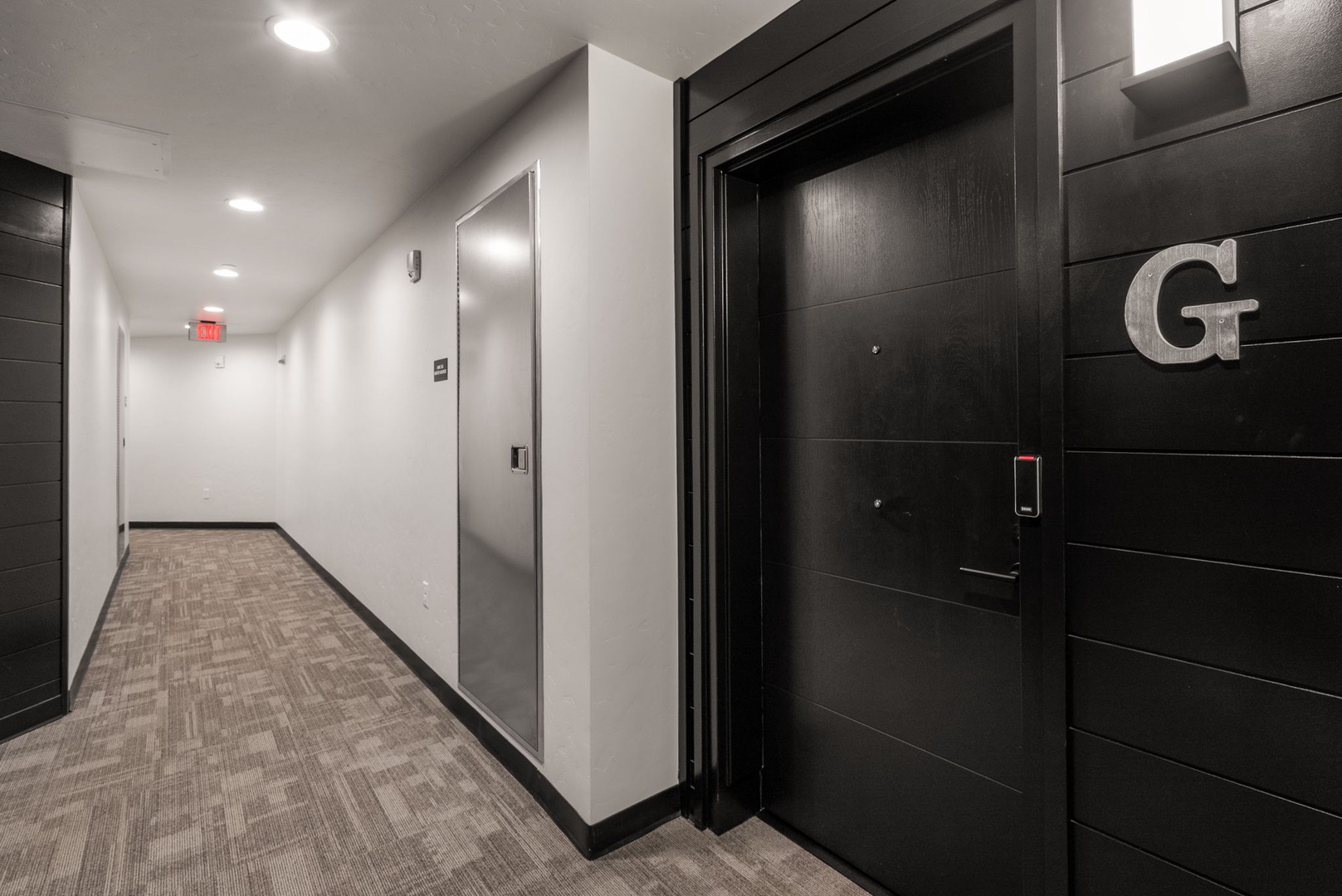 Step into the sleek, modern hallway as you arrive—your stay begins here, with a contemporary design that welcomes you home after your adventures in the area.