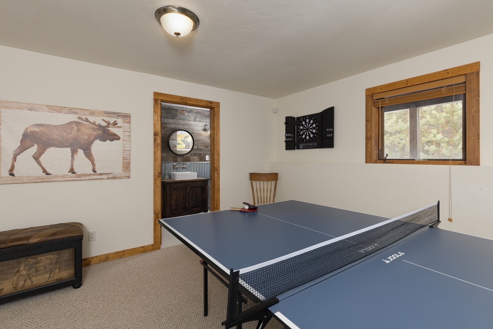 Your own game room awaits with ping pong and darts, perfect for friendly competition after mountain adventures.