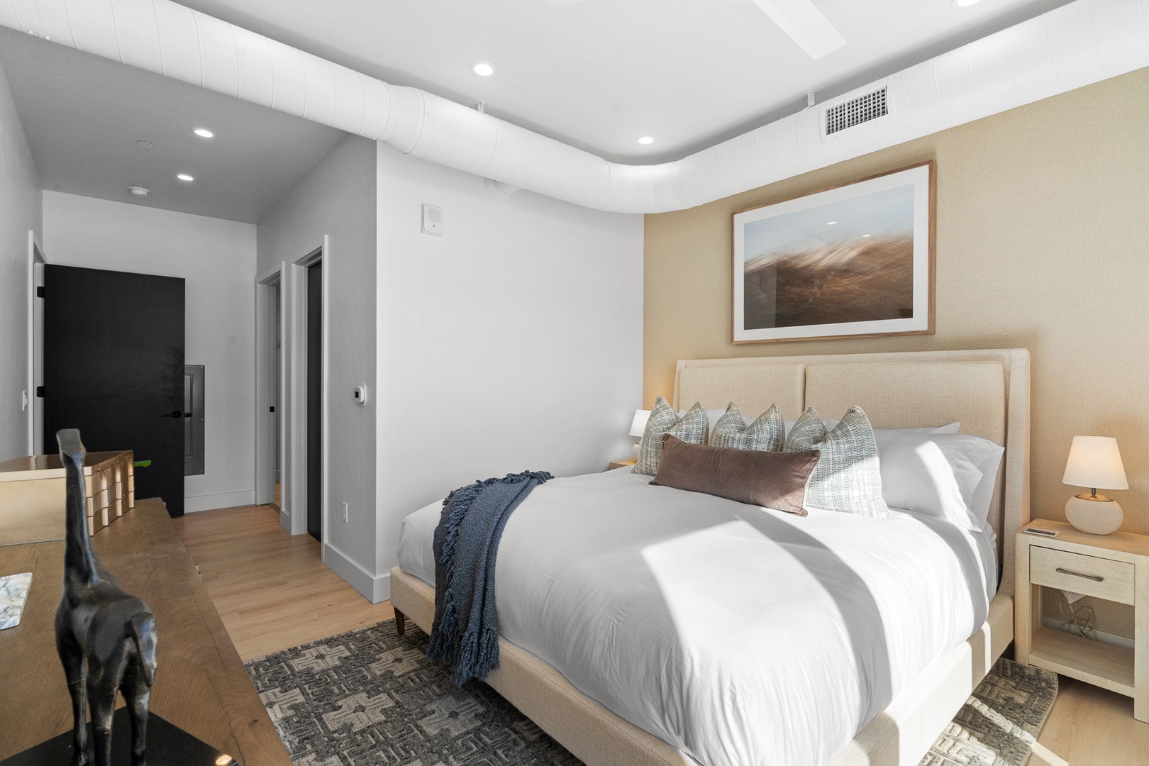 Drift off to dreamland in your tranquil retreat, where soft linens and warm lighting create the perfect sanctuary for rest.