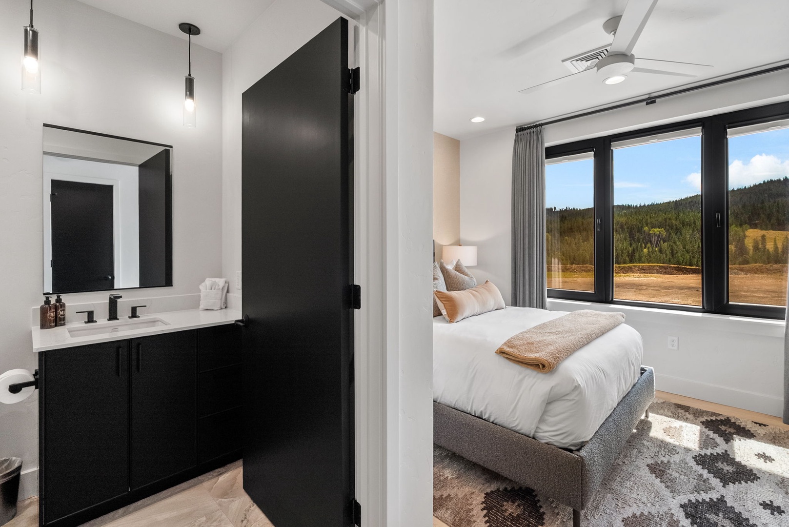 Wake up to stunning mountain views from your serene bedroom, where natural light and stylish comfort create the perfect retreat for rest and relaxation.