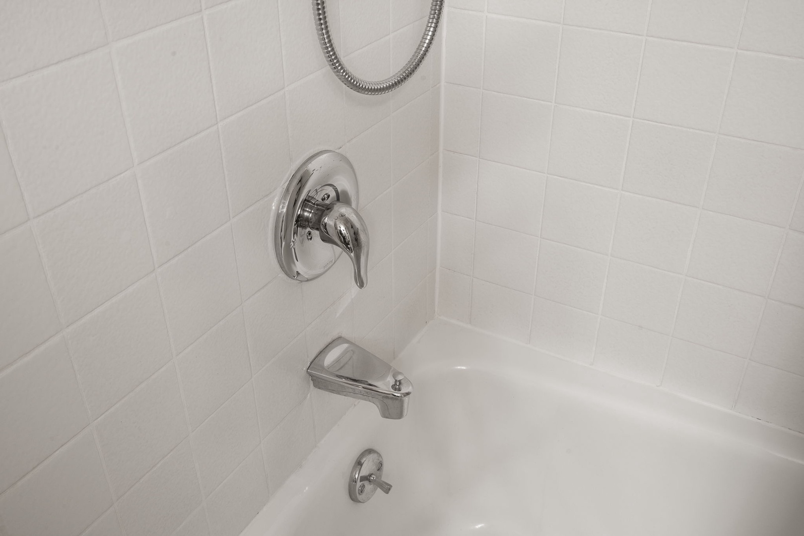 Unwind in your private bathtub after exploring the city, with gleaming chrome fixtures and pristine white tiles creating a spa-like retreat.