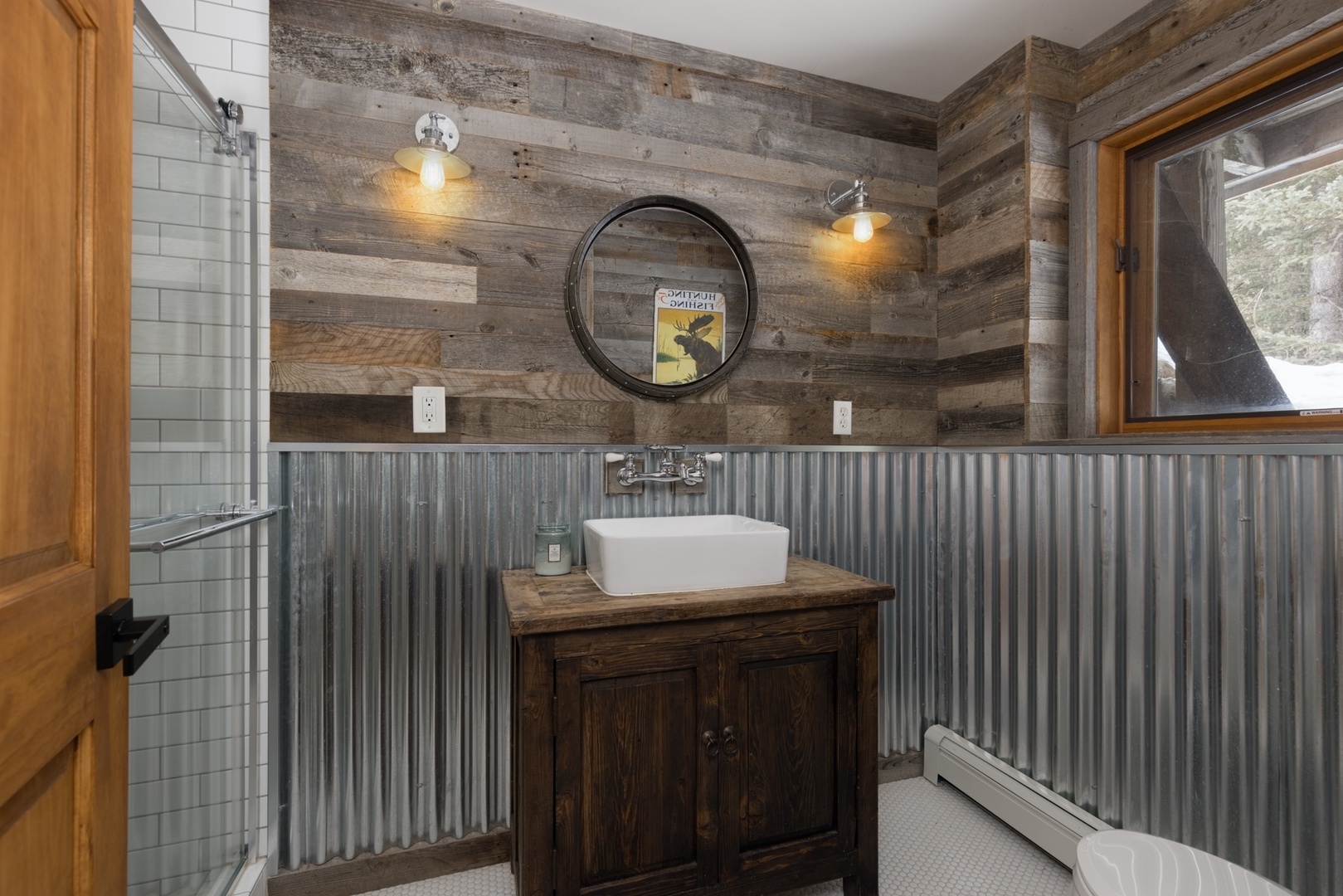 Unwind in this rustic bathroom where reclaimed wood meets modern fixtures, creating your own cozy retreat.