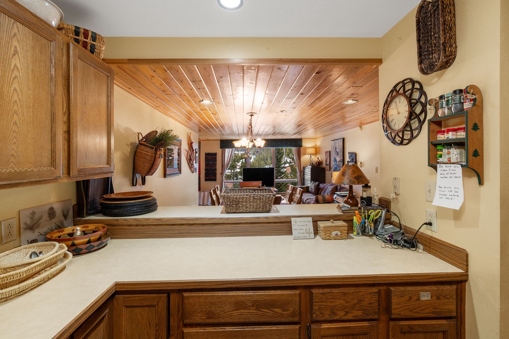 Your well-equipped kitchen features warm wood cabinetry and spacious counters, perfect for preparing meals during your stay.