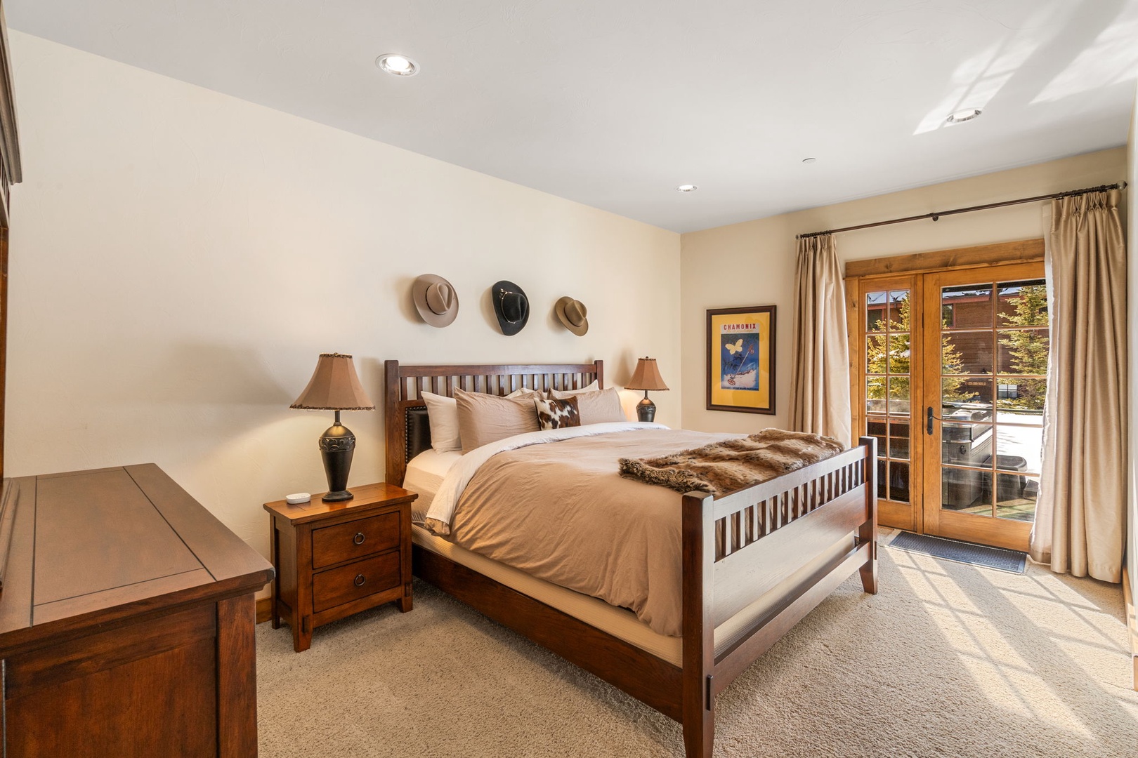 Sink into cozy comfort in your western-inspired bedroom, where warm wood furnishings and soft linens create your perfect retreat.