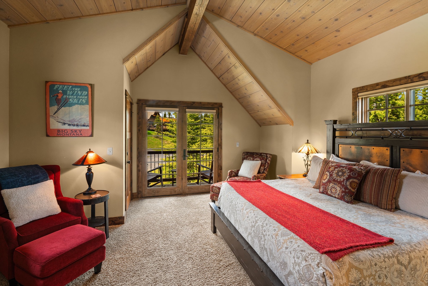 Step into your cozy mountain retreat with vaulted pine ceilings and plush bedding. French doors open to your private balcony overlooking lush green landscapes—your perfect escape.