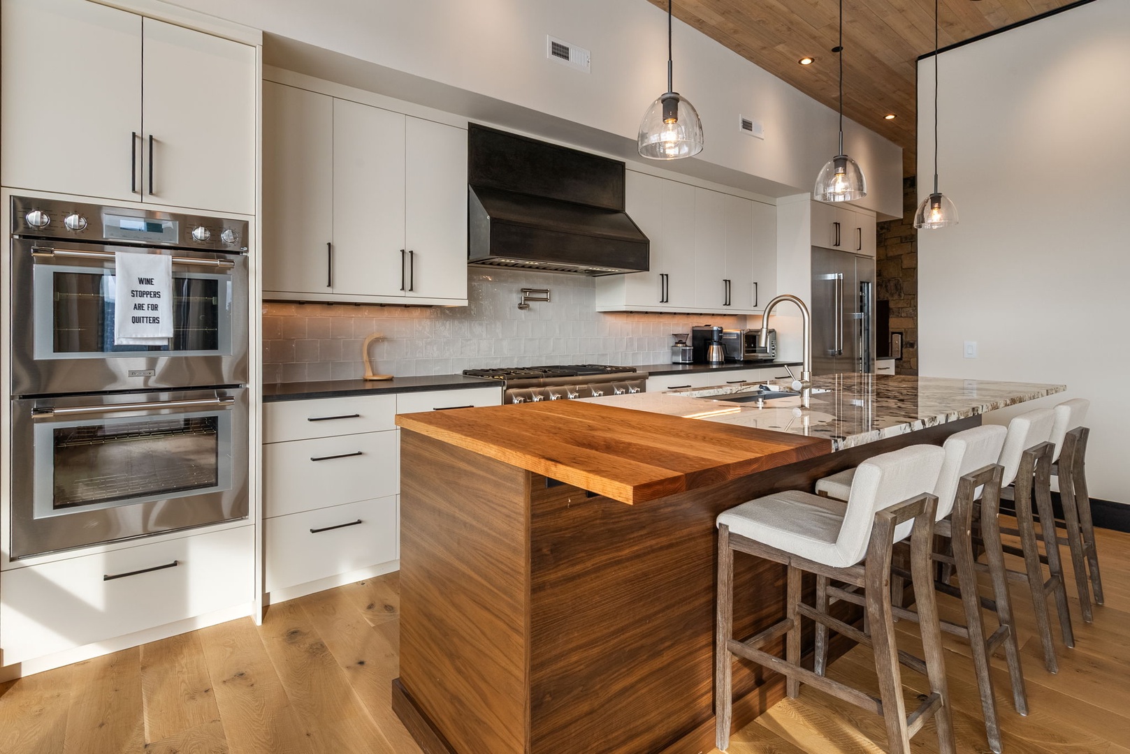 Your gourmet kitchen awaits with premium appliances, spacious island seating, and elegant pendant lighting for memorable meals together.