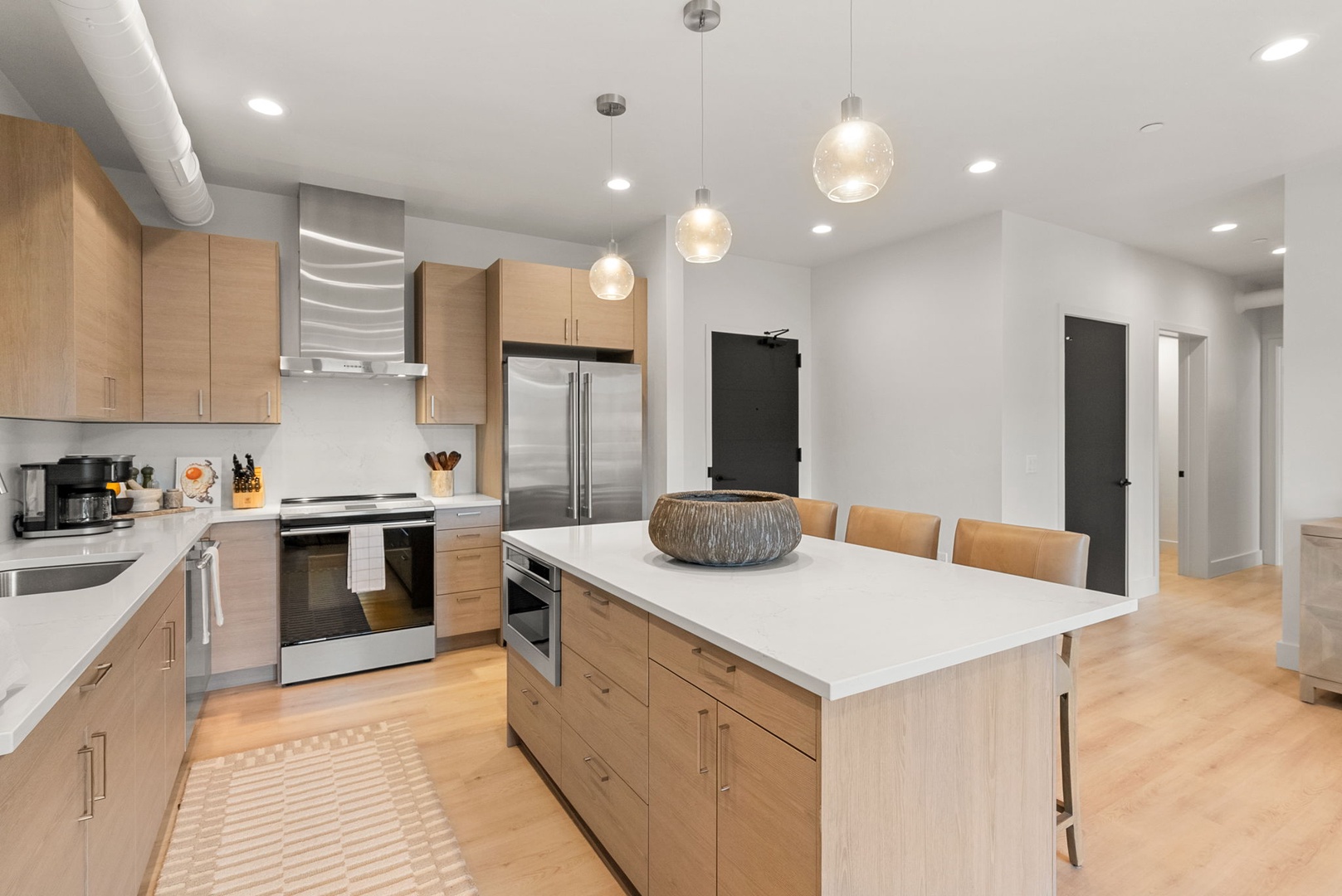 Your modern kitchen features sleek countertops, stainless steel appliances, and a spacious island perfect for cooking and gathering with loved ones.