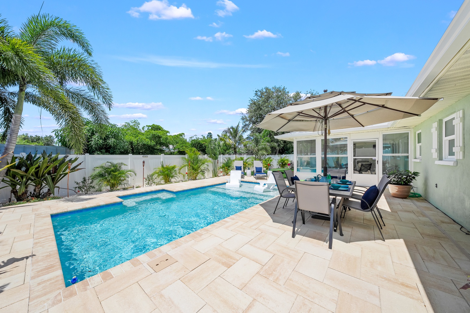 Sunny Pool Deck and Shaded Outdoor Dining