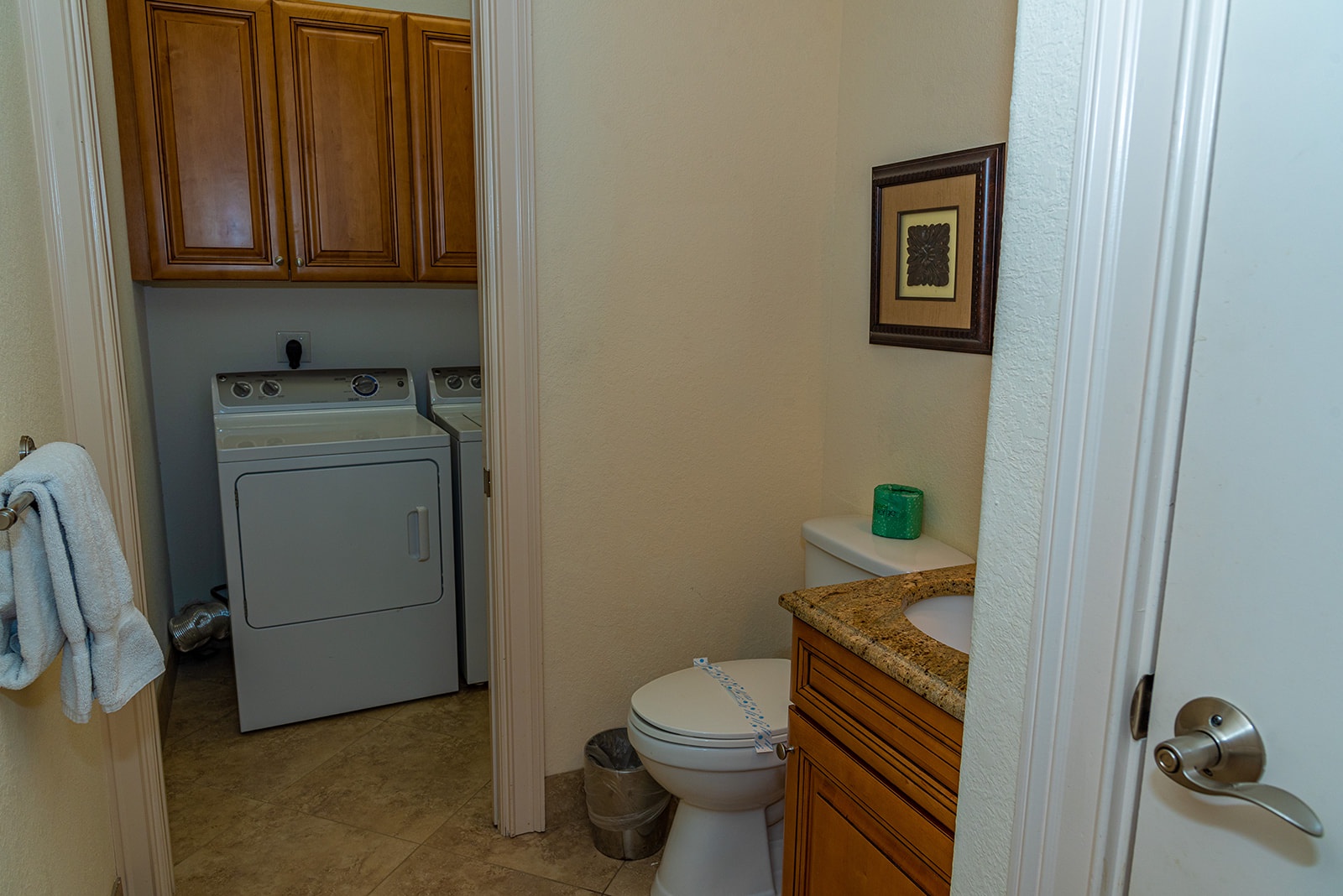 Guest bath on main floor with access to laundry room