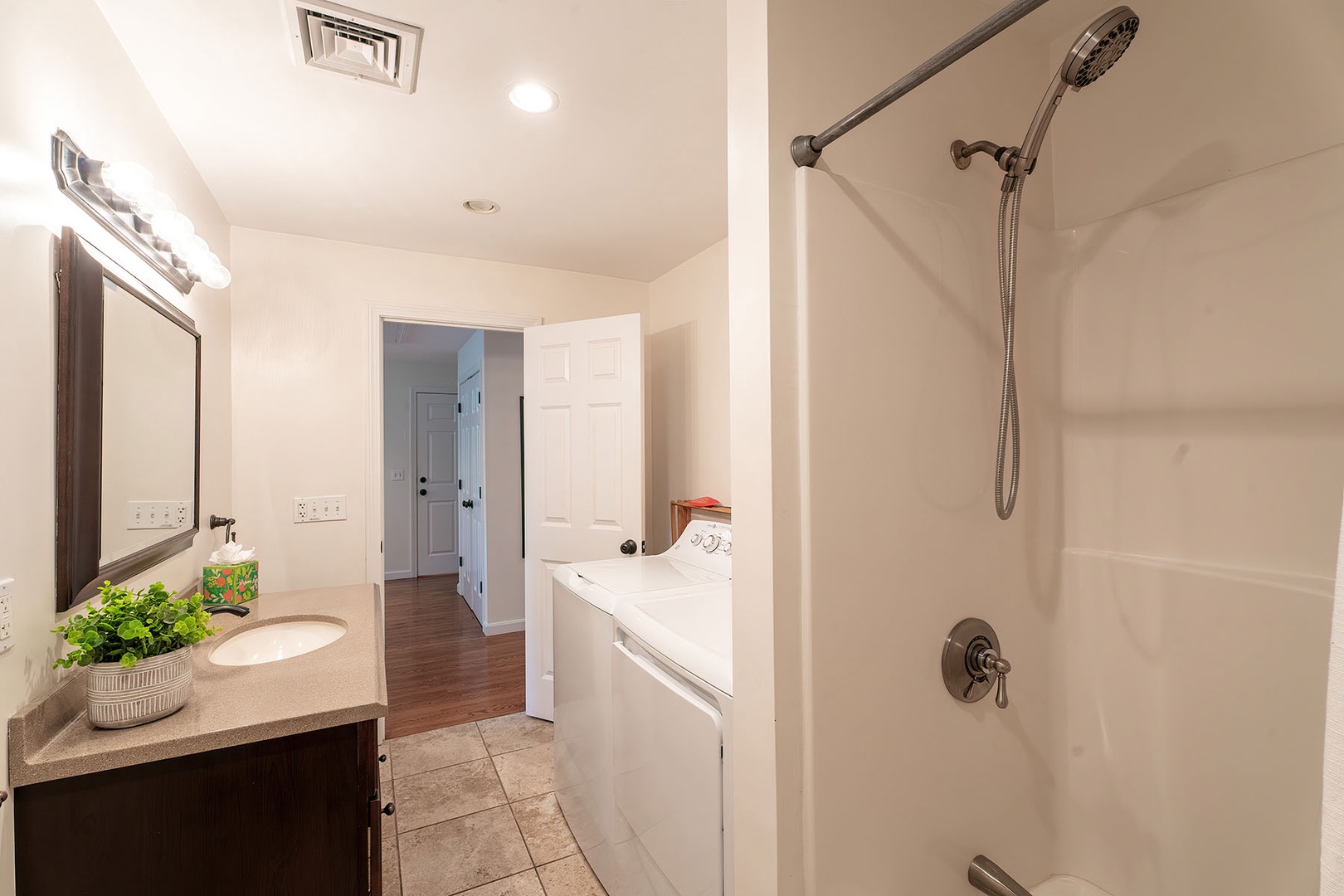 Apartment full bathroom with laundry