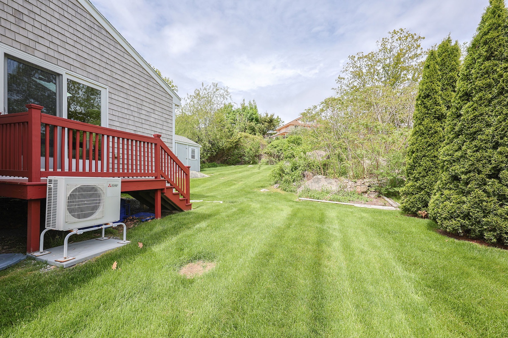 The back deck and the lush green backyard