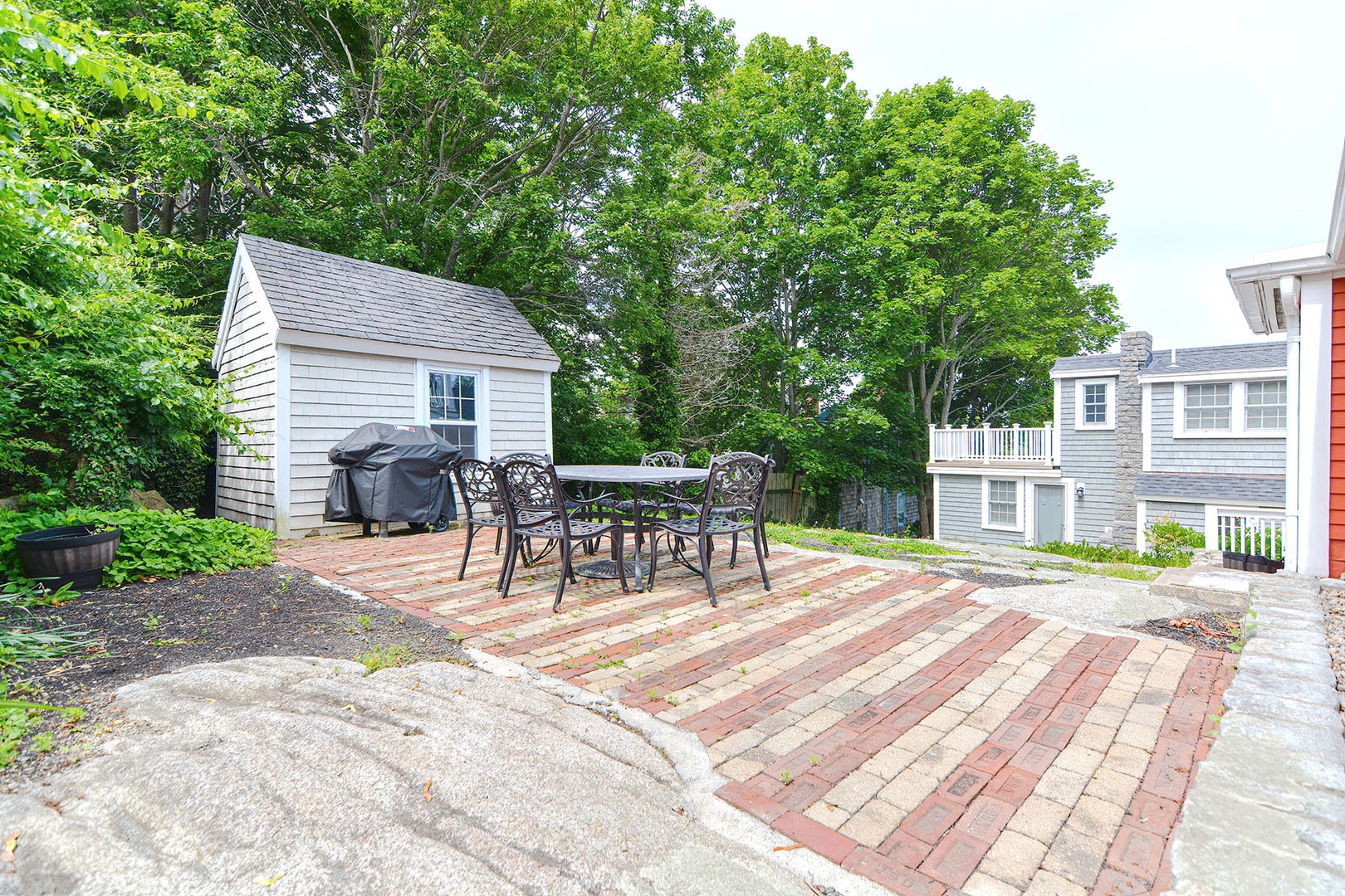 Enjoy the outdoors relaxing on one of the two backyard patios.
