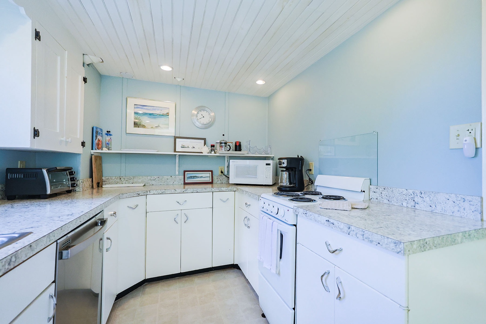 The kitchen is spacious with plenty of room to cook and store essentials.