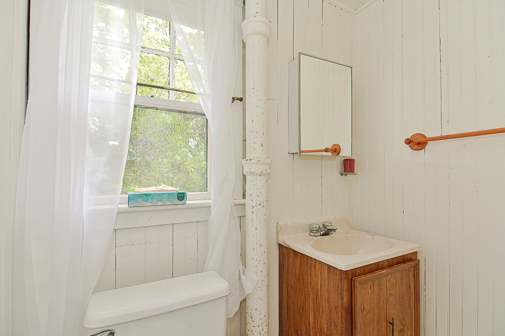 Full bathroom with walk-in shower.