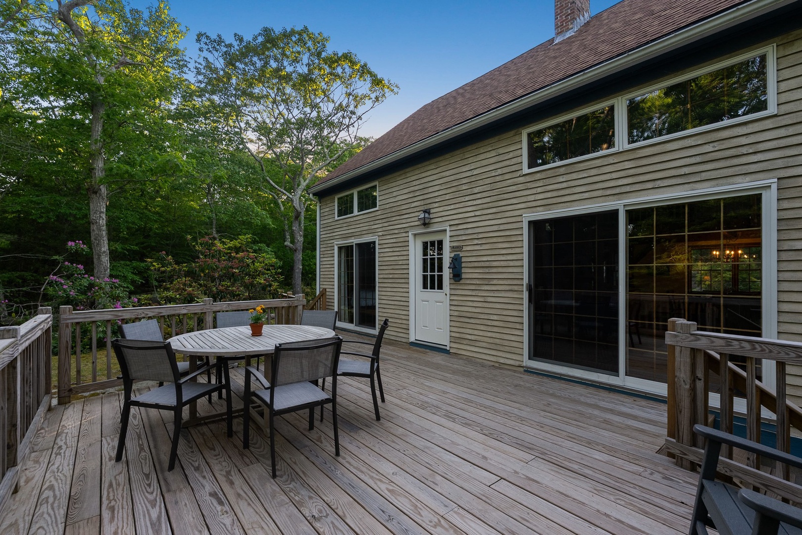 The spacious deck surrounded by greenery.