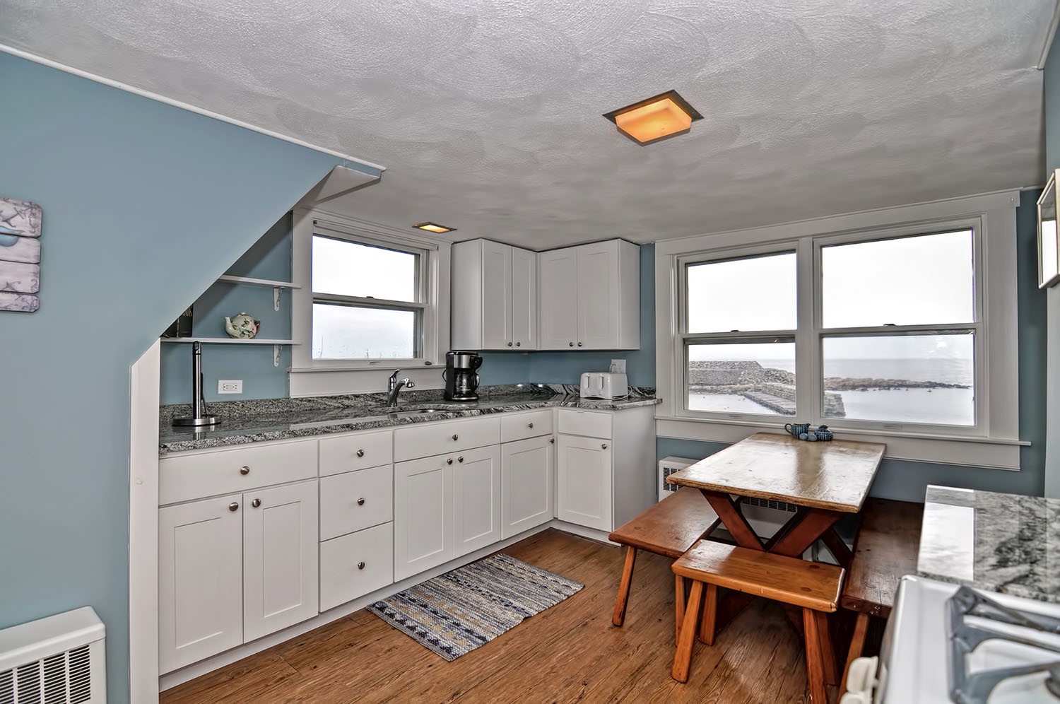 The kitchen has granite countertops and an ocean view.