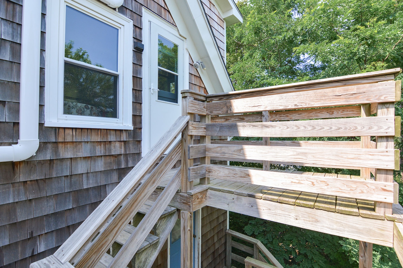 At the top of the stairs, there is a small balcony.
