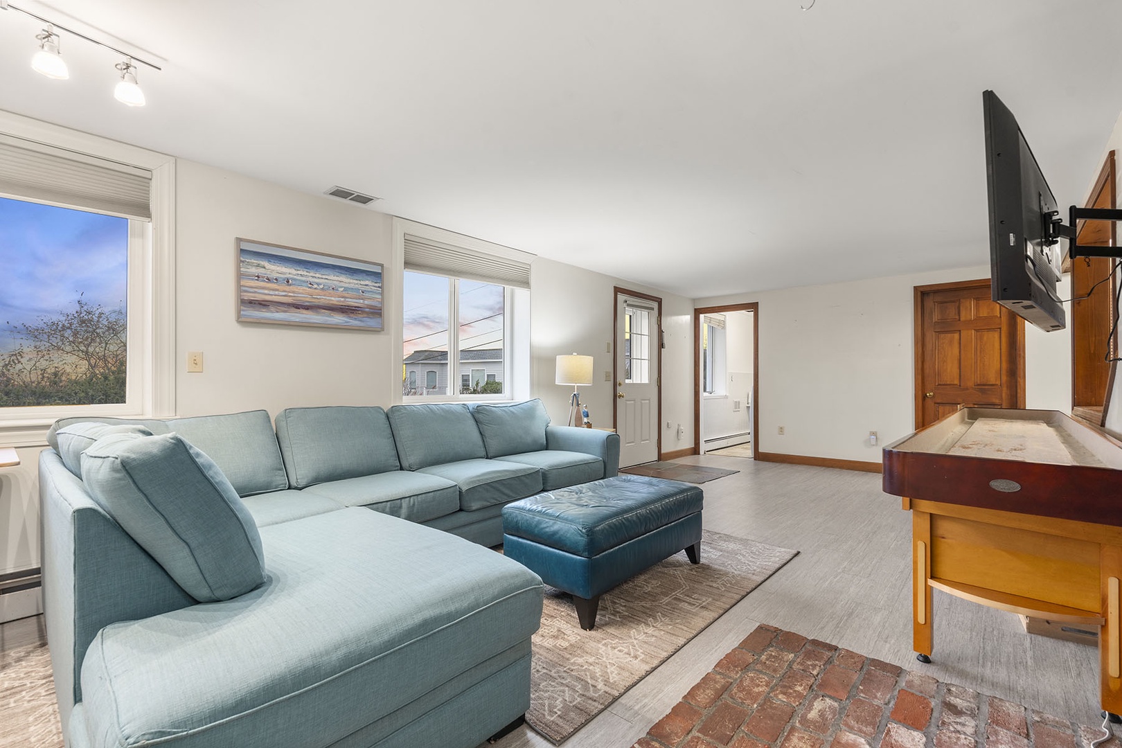 The lower floor offers another open plan living room with ample space.