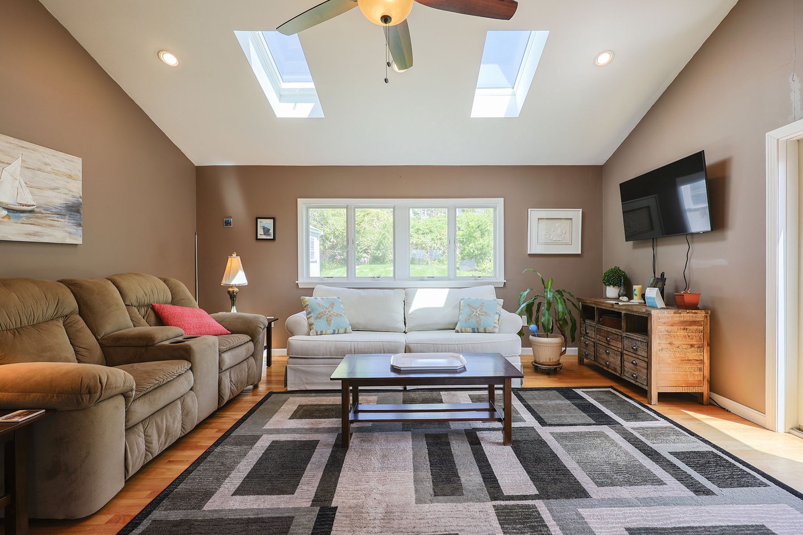A bright and cozy den with additional comfortable seating