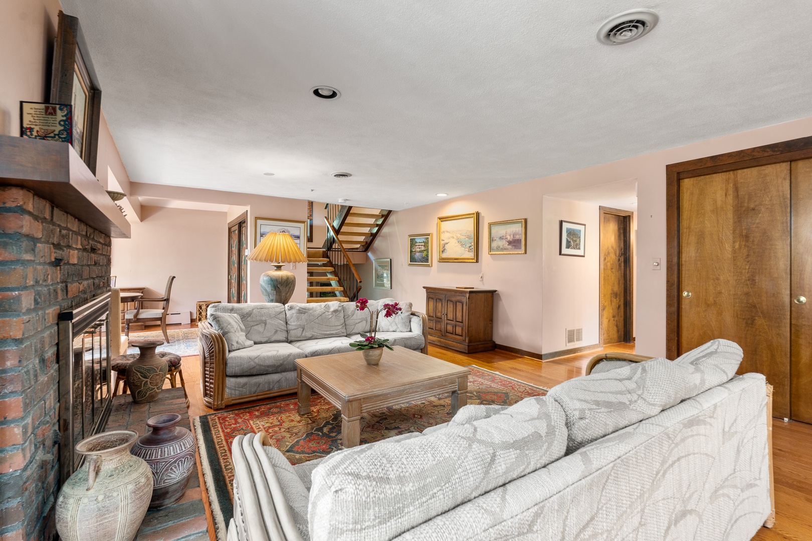 The living room, overlooking the stairs to the second floor.